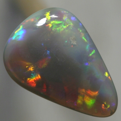 SOLID SEMI BLACK OPAL Bright rolling flashes, orange, green and purple